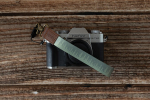 pinetree green keychain attached to lighweight dslr