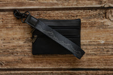 Load image into Gallery viewer, black with printed mountains and stars keychain attached to wallet
