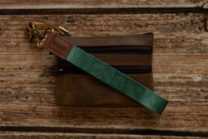 Tropical printed green wristlet keychain with brown leather ends and bronze hook