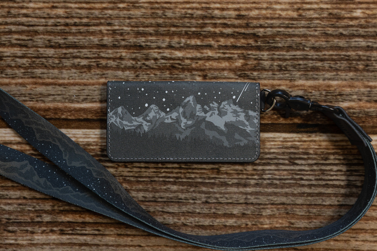 Parks at Night SD card holder featuring the Grand Teton range under a starry night sky, attached to a matching lanyard