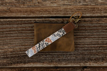 Load image into Gallery viewer, wildflower floral keychain attached to brown leather wallet
