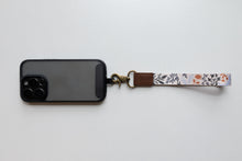 Load image into Gallery viewer, wildflower floral keychain attached to phone case
