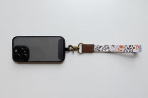 wildflower floral keychain attached to phone case