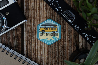 Sticker Featuring vw bus with surfboard and waves with words saying enjoy the journey, respect the destination 