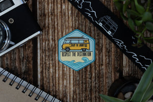 Sticker Featuring vw bus with surfboard and waves with words saying enjoy the journey, respect the destination 