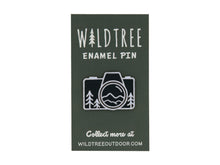Load image into Gallery viewer, Wildtree Camera mountain enamel pin featuring trees and mountains in a camera shape
