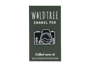 Wildtree Camera mountain enamel pin featuring trees and mountains in a camera shape