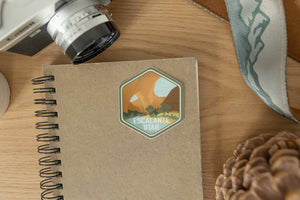 Escalante utah sticker on notebook and wood background