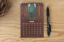 Load image into Gallery viewer, 2023 April Redwood national park calendar sitting up on desk
