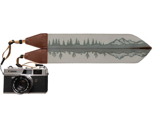 Wildtree Landscape Camera Strap with trees, Cacti and Mountains connected to canon camera