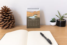 Load image into Gallery viewer, 2023 national park calendar sitting up on desk
