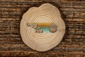 Smokey Bear Only You Retro Sticker laying on wood