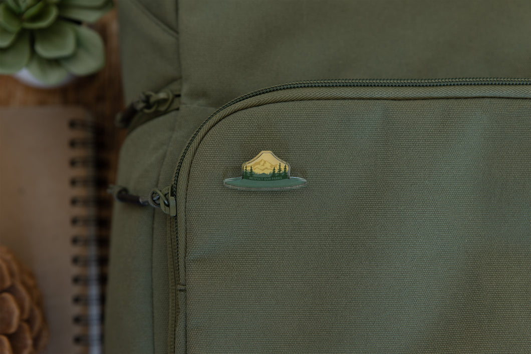 Wildtree park ranger hat pin displaying words 