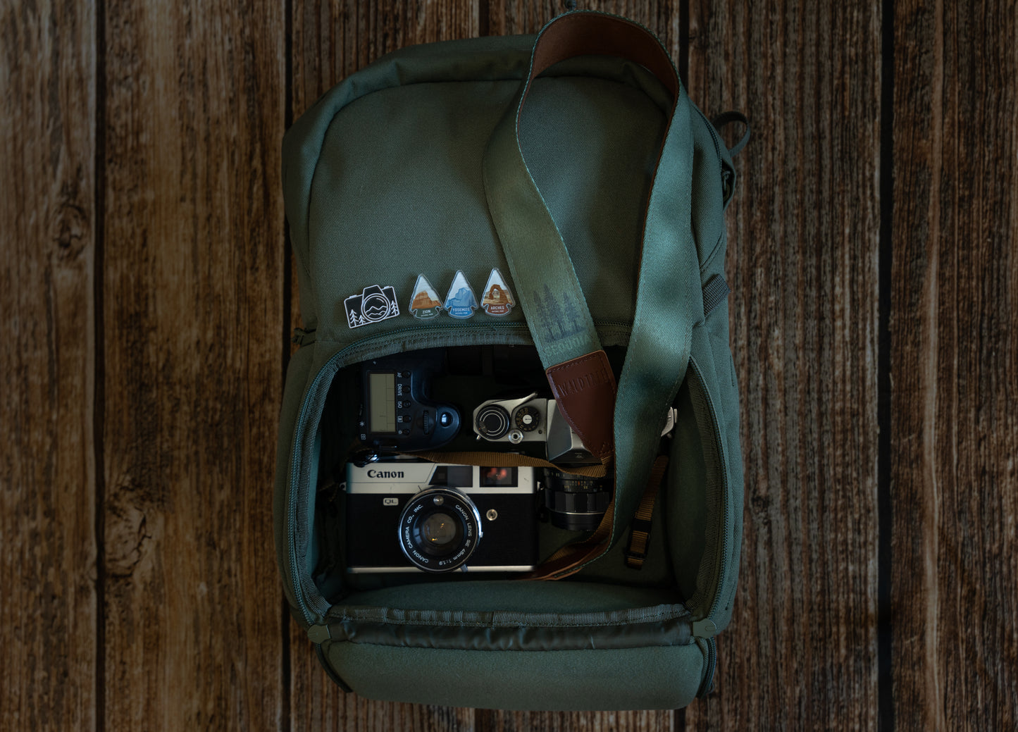 Sequoia National Park Camera Straps laying on backpack full of cameras