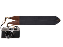 Load image into Gallery viewer, Black Solid color camera strap with brown backing and leather ends attached to canon camera
