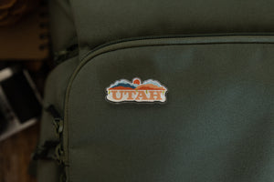 Wildtree Utah pin on back pack