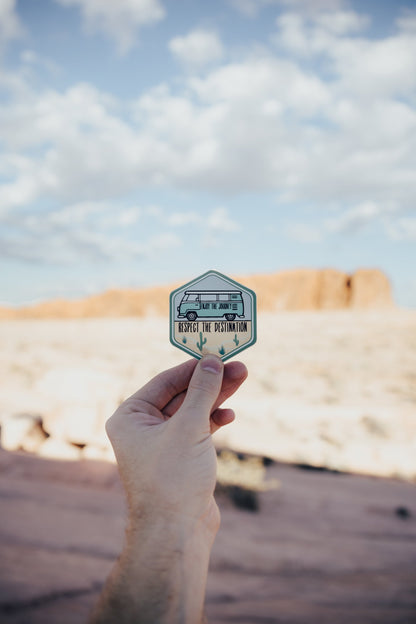 hand holding wildtree bus destination desert sticker in Valley of fire state park