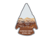 Load image into Gallery viewer, National park arrowhead shaped stickers of Petrified Forest national park in color
