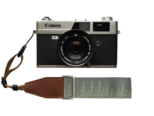 Wildtree Pine tree wrist strap attached to Canon film camera