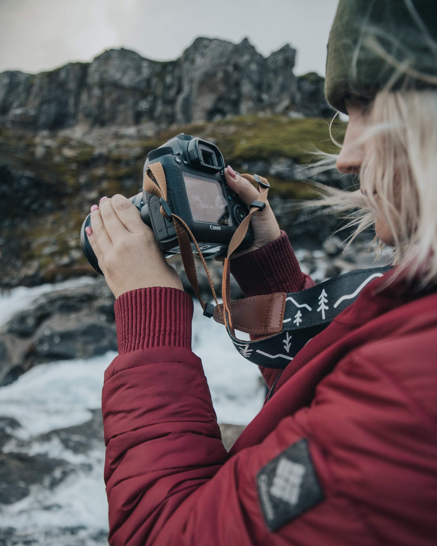 Women holding DSLR looking through Camera photos wearing Wildtree Camera strap