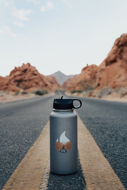 Wildtree Valley of Fire State Park Sticker on Hydro Flask sitting in middle of road