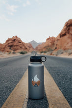 Load image into Gallery viewer, Wildtree Valley of Fire State Park Sticker on Hydro Flask sitting in middle of road
