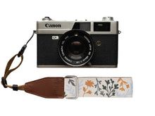 Load image into Gallery viewer, Wildtree Wildflower Floral camera wrist strap attached to Canon film camera
