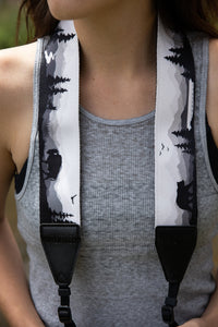 Women wearing Wildtree Wildlife Camera Strap featuring Bear, Moose and Trees with mountain range background 