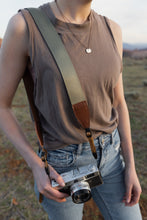 Load image into Gallery viewer, Woodland Green camera strap across women&#39;s shoulder
