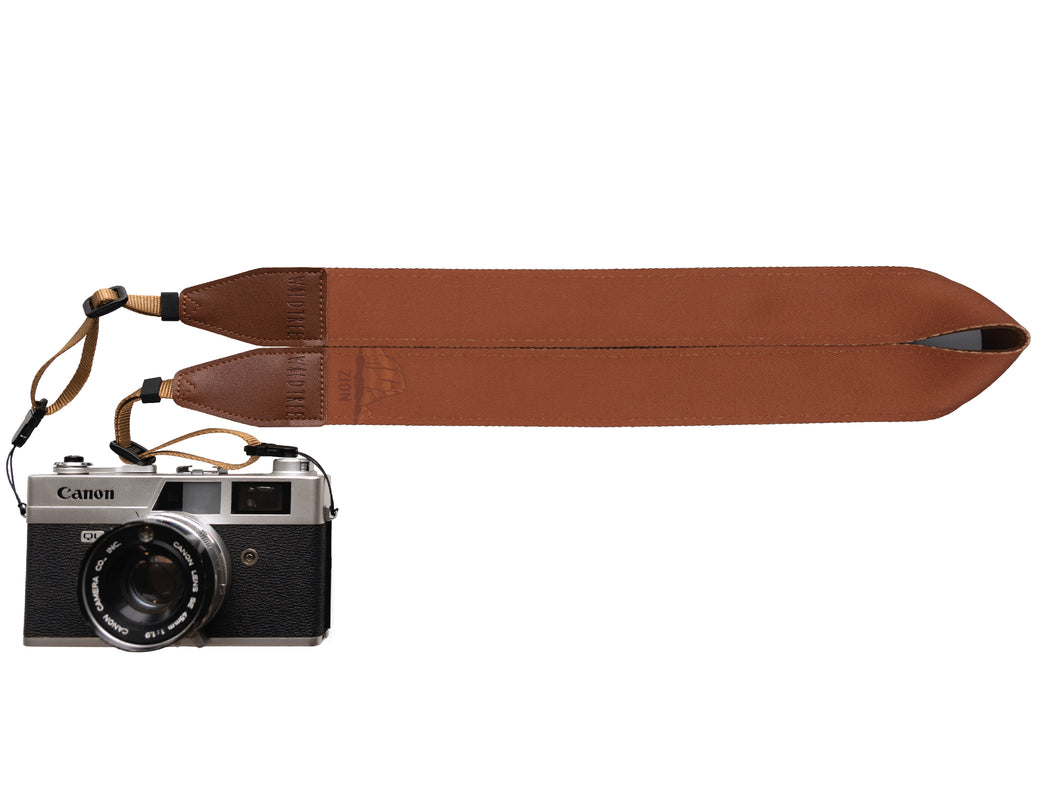 Zion National Park red colored camera strap attached to camera