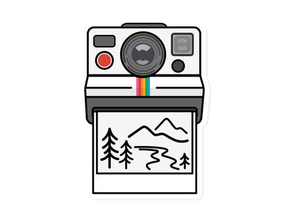 Sticker Graphic of Old Polaroid Camera Ejecting photo with illustration of mountains and trees