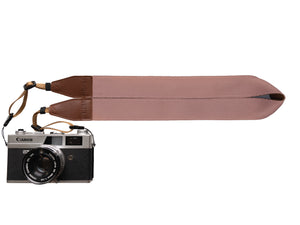 Pressed flower pink camera strap attached to Canon camera
