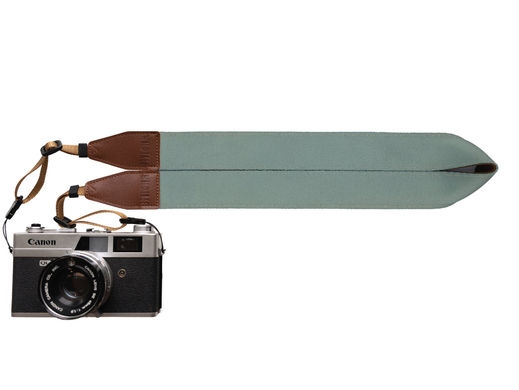 Wildtree Succulent colored single color camera strap attached to canon camera