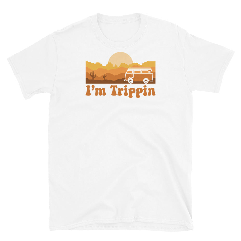 white unisex basic soft style t-shirt with orange design of vintage bus, desert mountains, sun, cacti and sun