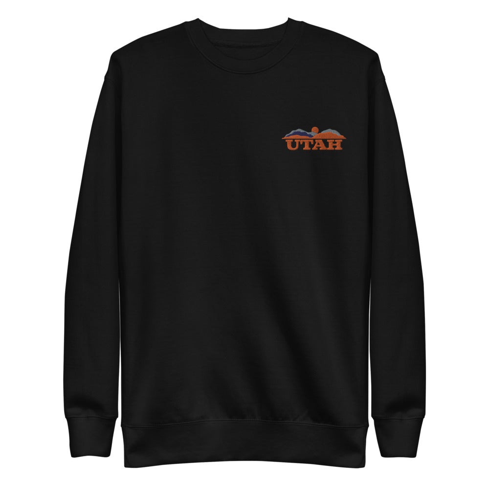 Black unisex fleece pullover with words "Utah" and mountains on left side top of shirt