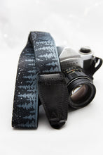 Load image into Gallery viewer, Wildtree Night Sky Camera Strap featuring black pinetree tree-line and stars
