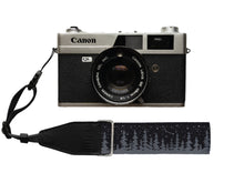 Load image into Gallery viewer, wildtree Night Sky Camera Wrist Strap black with stars and pinetree tree line attached to Film camera
