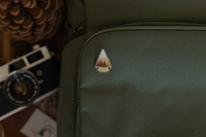 wildtree canyonlands acrylic pin on backpack closeup