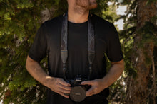 Load image into Gallery viewer, wildtree midnight mountain camera strap around neck holding camera
