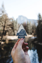 Load image into Gallery viewer, hand holding yosemite national park sticker in front of a half dome in yosemite national park
